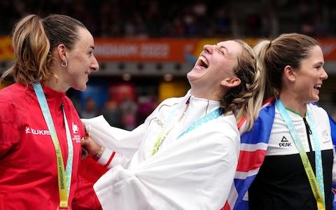 England's Laura Kenny (centre) laughs with her gold medal, alongside New Zealand's Michaela Drummond (right) with silver and Canada's Maggie Coles-Lyster with bronze